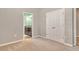 Bedroom featuring neutral walls, carpet, closet, and an ensuite bathroom view at 364 Grande Vista Blvd, Bradenton, FL 34212