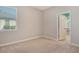 Bright bedroom with neutral walls, carpet, and natural light from the window at 364 Grande Vista Blvd, Bradenton, FL 34212