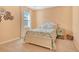 Bright bedroom featuring queen bed with coastal décor and window with blinds at 364 Grande Vista Blvd, Bradenton, FL 34212
