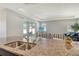 A kitchen island with granite countertops that flows seamlessly into the living room at 364 Grande Vista Blvd, Bradenton, FL 34212