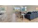 Open living area with comfortable seating, tile floors, and sliding glass doors leading to the outdoors at 364 Grande Vista Blvd, Bradenton, FL 34212