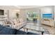 Bright living room with tile floors, stylish furniture and a sliding glass door leading to screened patio at 364 Grande Vista Blvd, Bradenton, FL 34212