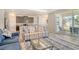 Open living space features a modern kitchen, tile flooring, stylish furniture, and access to a lanai at 364 Grande Vista Blvd, Bradenton, FL 34212