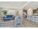 Open-concept living space with modern kitchen, comfortable seating, and tile flooring offers seamless living at 364 Grande Vista Blvd, Bradenton, FL 34212