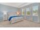 Relaxing main bedroom featuring three large windows and neutral carpet at 364 Grande Vista Blvd, Bradenton, FL 34212