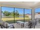 Screened patio offering a peaceful view of a pond and fountain, with comfortable seating for relaxation at 364 Grande Vista Blvd, Bradenton, FL 34212