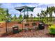 Community playground featuring a covered play structure, grills, and picnic areas, perfect for Gathering gatherings and outdoor fun at 364 Grande Vista Blvd, Bradenton, FL 34212