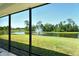 Beautiful view from screened lanai overlooking pond with fountain and lush green lawn at 364 Grande Vista Blvd, Bradenton, FL 34212