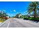 Beautiful gated community entrance with lush landscaping and stately signage welcomes you home at 364 Grande Vista Blvd, Bradenton, FL 34212