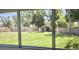 Views of the backyard with manicured lawn and privacy fence at 3730 Ferguson St, Sarasota, FL 34233