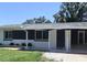 Charming single story home featuring a covered front porch and well-maintained lawn at 3730 Ferguson St, Sarasota, FL 34233