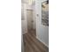 Well-lit hallway features clean lines, fresh paint, and modern laminate flooring at 3730 Ferguson St, Sarasota, FL 34233