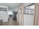 Bright living room with neutral décor, open floor plan with an adjacent dining area and modern stainless steel refrigerator at 3730 Ferguson St, Sarasota, FL 34233