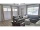 Bright living room with lots of natural light, featuring a comfortable seating area and neutral decor at 3730 Ferguson St, Sarasota, FL 34233