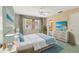 Comfortable bedroom with a ceiling fan, natural light, and stylish decor at 3816 Blue Stone Way # 97, Sarasota, FL 34232