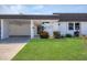 Charming single-story home with a carport and well-manicured front lawn at 3816 Blue Stone Way # 97, Sarasota, FL 34232