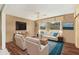 Inviting living room with comfortable seating, a ceiling fan, and large windows at 3816 Blue Stone Way # 97, Sarasota, FL 34232