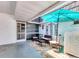 Comfortable covered patio with brick flooring, lounge furniture, and stylish decor on the stucco wall at 3816 Blue Stone Way # 97, Sarasota, FL 34232