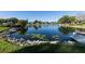 Scenic community pond with a fountain surrounded by lush landscaping, creating a peaceful environment at 3816 Blue Stone Way # 97, Sarasota, FL 34232