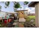 Unique backyard featuring a shed adorned with artwork, along with artistic touches, creating a whimsical outdoor space at 4015 Asbury Pl, Sarasota, FL 34233