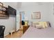 Comfortable bedroom showcasing a mounted TV, comfortable bed, and charming decor for a relaxed atmosphere at 4015 Asbury Pl, Sarasota, FL 34233