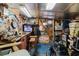 Detailed garage interior featuring tools, posters, and motorcycle, perfect for hobbyists and collectors at 4015 Asbury Pl, Sarasota, FL 34233