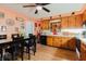 Large eat-in kitchen features tile countertops, wood cabinets and ceiling fan at 4015 Asbury Pl, Sarasota, FL 34233