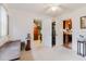 Spacious, neutral-toned room with multiple doorways, offering versatile living space and abundant natural light at 4015 Asbury Pl, Sarasota, FL 34233