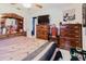Well lit main bedroom offers wood furniture and a ceiling fan at 4015 Asbury Pl, Sarasota, FL 34233