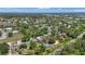 A neighborhood aerial view shows mature trees, beautiful surroundings and community features at 4251 Austin St, Sarasota, FL 34233