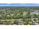 Enjoy the surroundings in this aerial view of the neighborhood with mature trees at 4251 Austin St, Sarasota, FL 34233
