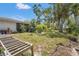 Lush backyard featuring a fire pit and ample space for outdoor entertaining and relaxation at 4251 Austin St, Sarasota, FL 34233