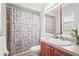 Neutral bathroom featuring a shower/tub combo and single sink vanity at 4251 Austin St, Sarasota, FL 34233