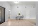 Open dining area provides access to both the bedroom and the screened in lanai at 4251 Austin St, Sarasota, FL 34233