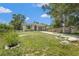 Well-kept home with a long driveway, lush lawn, landscaping, and a cozy, inviting one car garage at 4251 Austin St, Sarasota, FL 34233