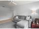 Inviting living room with a gray sectional sofa, plush rug and bright natural light at 4251 Austin St, Sarasota, FL 34233