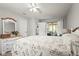 Comfortable carpeted main bedroom featuring a queen bed and a dresser with mirror at 4251 Austin St, Sarasota, FL 34233