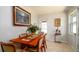 Cozy dining room features a wooden table, seating for four, and bright natural light at 4310 7Th W Ave, Bradenton, FL 34209