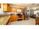 Open-concept kitchen with granite countertops, stainless steel appliances, and ample cabinet space at 4310 7Th W Ave, Bradenton, FL 34209