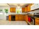 Bright kitchen featuring granite countertops, modern appliances, and updated cabinets at 4310 7Th W Ave, Bradenton, FL 34209