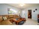 Comfortable living room features tile floors, fan, and natural light at 4310 7Th W Ave, Bradenton, FL 34209