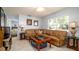 Comfortable living room features tile floors, fan, and natural light at 4310 7Th W Ave, Bradenton, FL 34209