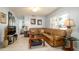 Comfortable living room features tile floors, fan, and natural light at 4310 7Th W Ave, Bradenton, FL 34209