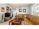 Comfortable living room features tile floors, fan, and natural light at 4310 7Th W Ave, Bradenton, FL 34209