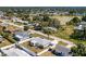 Aerial view of a fenced in home and yard in a tranquil neighborhood near a lake at 4375 Tortoise Rd, Venice, FL 34293