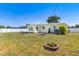 Fenced backyard with small garden beds and mature trees at 4375 Tortoise Rd, Venice, FL 34293
