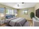 Bedroom features a plush bed, coordinating decor, and natural light at 4375 Tortoise Rd, Venice, FL 34293