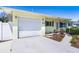 Inviting exterior showcasing the attached one-car garage, tidy landscaping, and well-maintained walkway at 4375 Tortoise Rd, Venice, FL 34293