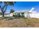 Well-maintained home with a fenced yard, showcasing its inviting facade and landscaping at 4375 Tortoise Rd, Venice, FL 34293