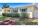 Charming home featuring blue shutters and well-maintained landscaping, adding to its curb appeal at 4375 Tortoise Rd, Venice, FL 34293
